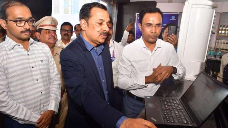 Special Chief Secretary (Excise) Rajat Bhargava launching the digital payment system at a liquor outlet in Vijayawada on Friday. | Photo Credit: G,N. RAO
